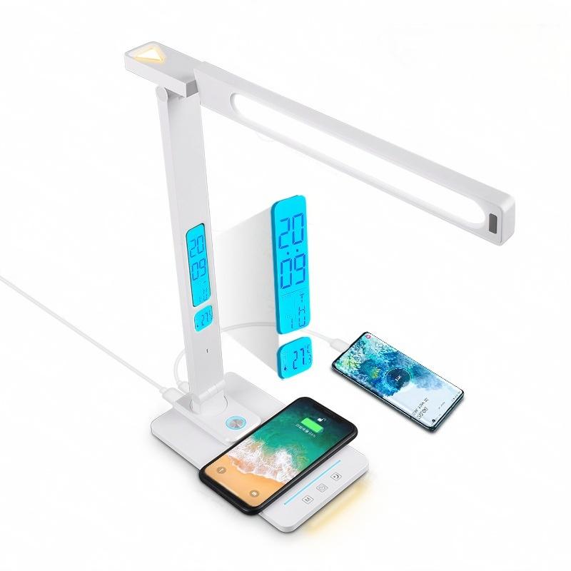 Multifunctional LED desk lamp with wireless charging, USB ports, adjustable brightness, and an integrated digital display showing time, date, and temperature.