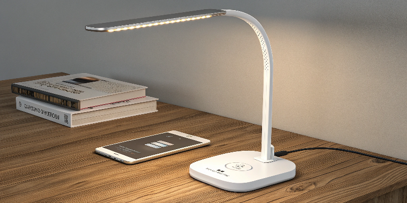 Wireless charging desk lamp with modern design, ideal for study or work areas