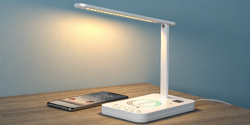 Minimalist LED desk lamp featuring phone charging and brightness settings