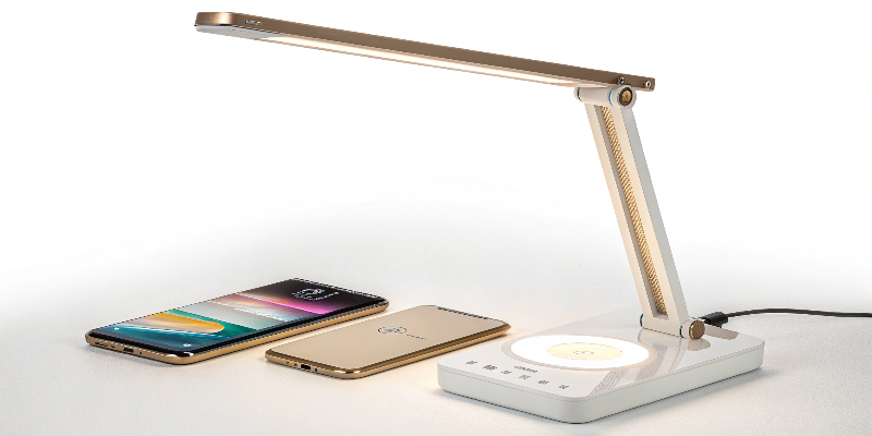 Adjustable LED desk lamp offering wireless charging and sleek aesthetics