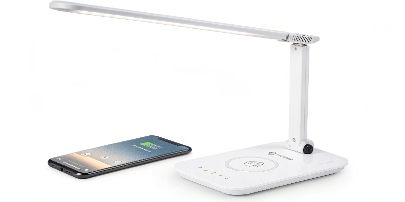 Compact LED desk lamp with wireless charging and adjustable lighting options