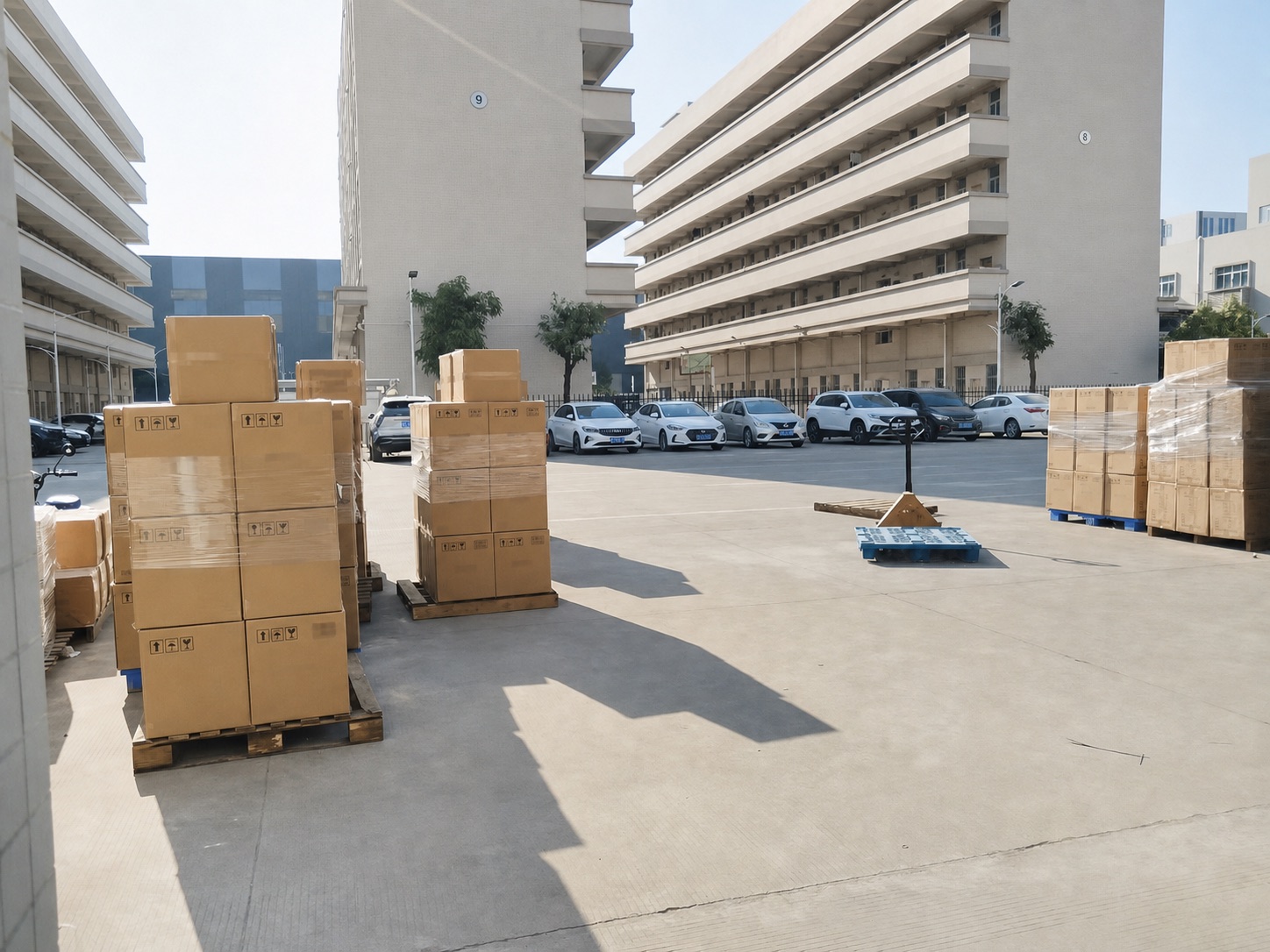 Bulk LED lamp cartons staged on pallets in a factory dispatch yard