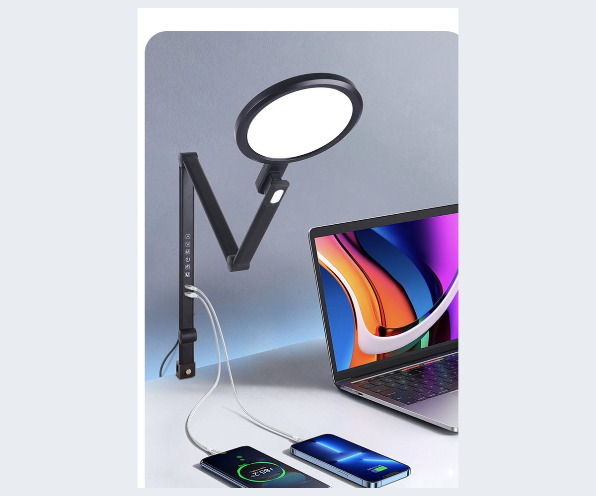 Complete articulated RY229-B clamp lamp beside a laptop and charging devices