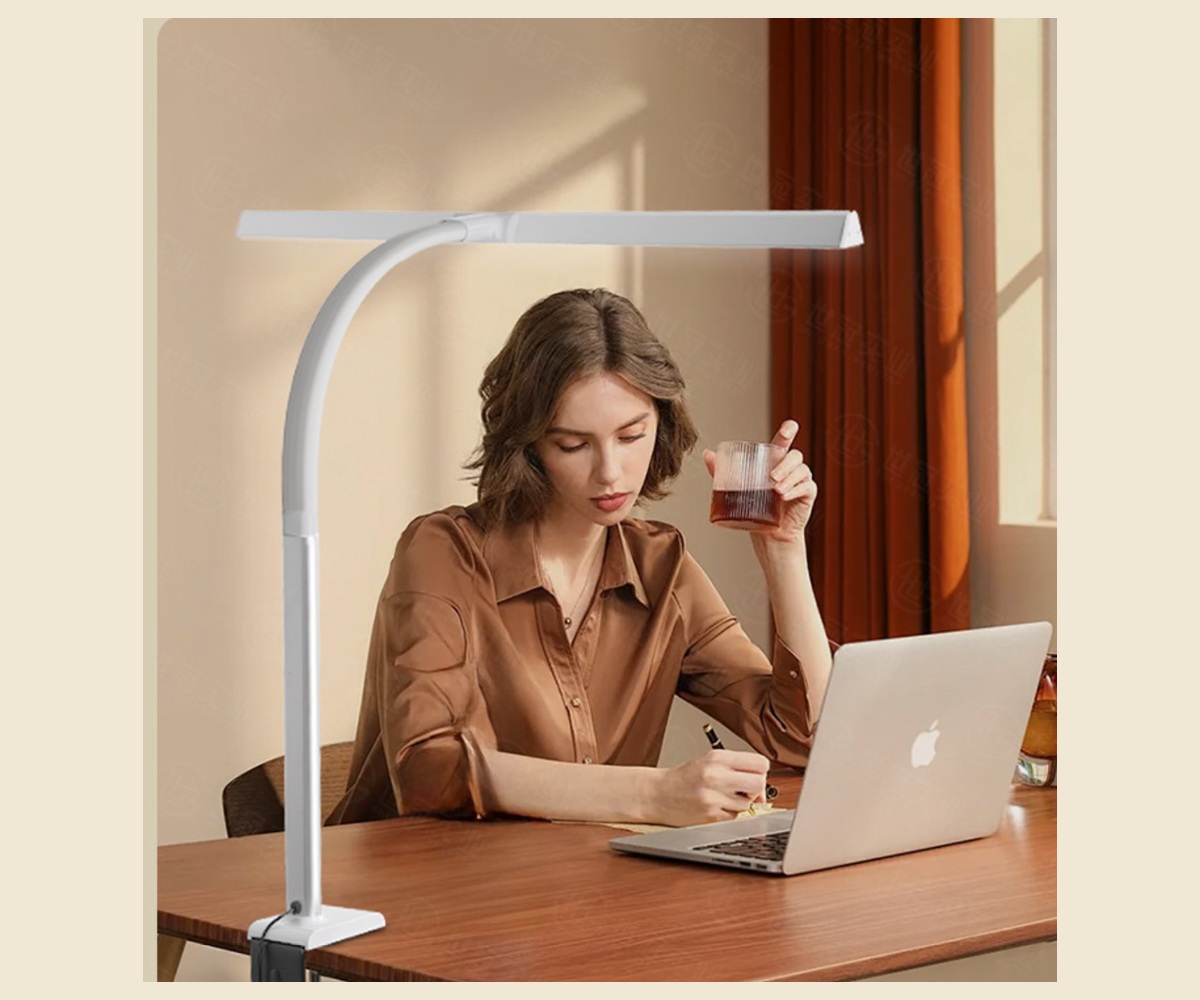 Complete wide clamp desk lamp lighting an office work surface